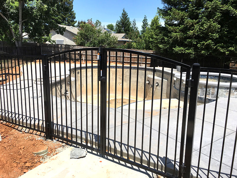 Iron Fence Gate Construction Iron gate with fence built for commercial property