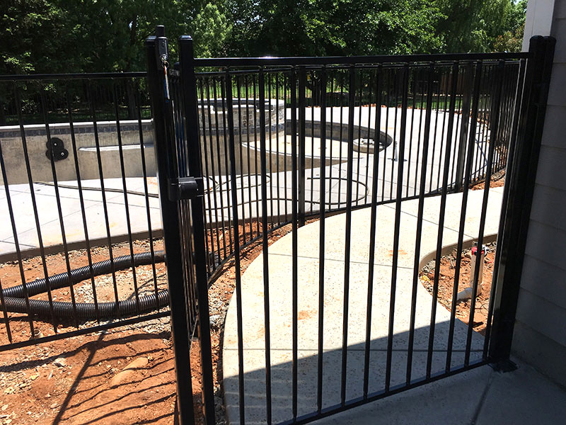 Iron Fence Gate Construction Iron gate with fence built for commercial property