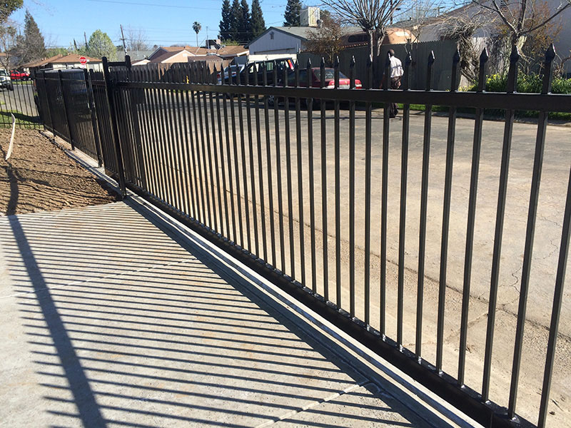 Iron Fence Gate Construction Iron fence with gate built for residential property