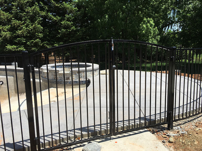 Iron Fence Gate Construction Iron fence with gate built for residential property