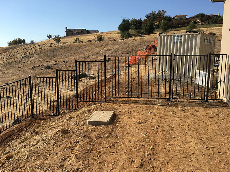 Iron Fence Gate Construction Iron fence with gate built for residential property