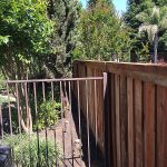 Wood fence with iron fence section built for residential property