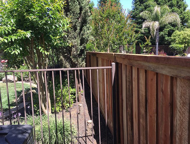 Wood fence with iron fence section built for residential property